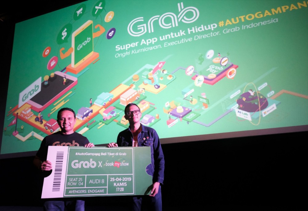 Executive Director Grab Indonesia Ongki Kurniawan dan perwakilan BookMyShow / DailySocial