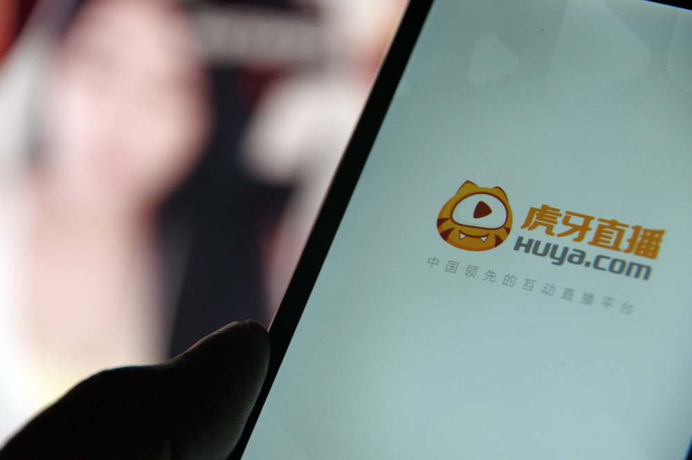 Tencent dorong agar Huya mau merger dengan Douyu. | Sumber: Deposit Photos