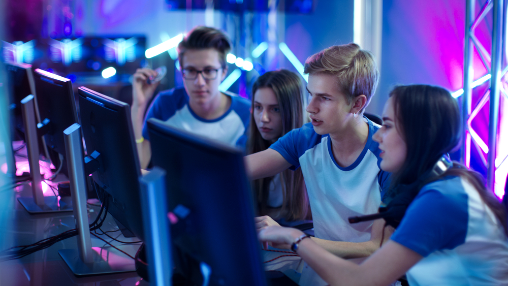 Team of Professional Boys and Girls Gamers Actively Thinking/ Di for SEO