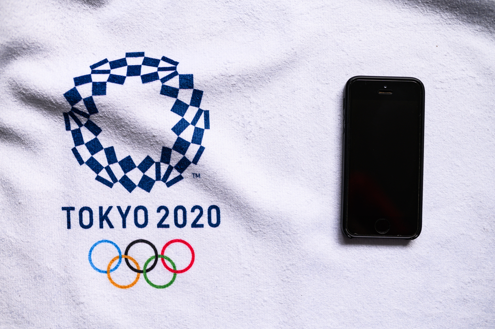 TOKYO, JAPAN, JANUARY. 20. 2020: Smartphone and Tokyo 2020 summer olympic game logo. Olympic application conceptual photo, white edit space for SEO