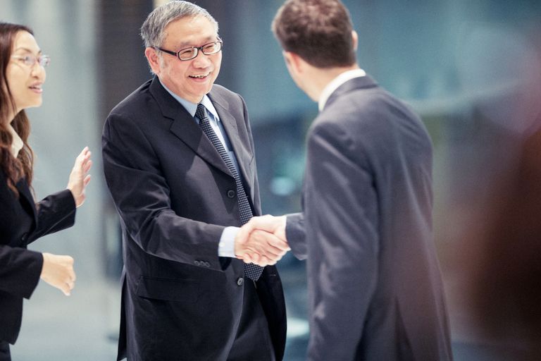 caucasian-businessman-closing-a-deal-in-hong-kong-with-his-asian-colleagues-942969420-5c7c646646e0fb000140a46b for SEO
